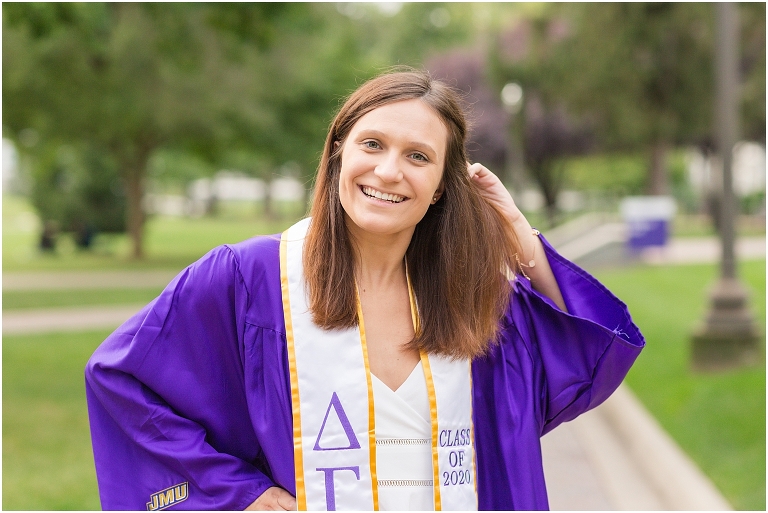 JMU senior posing on the Quad during senior photoshoot.