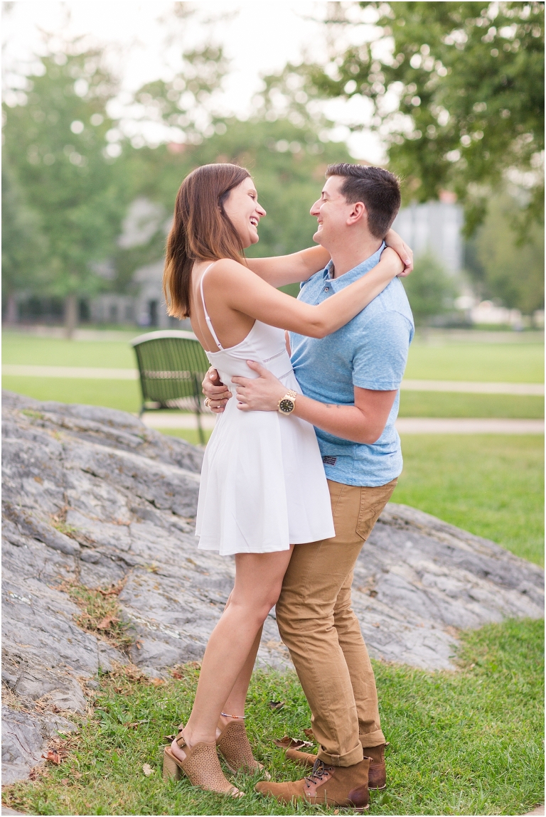 Couple laughing with each other during photoshoot at JMU.