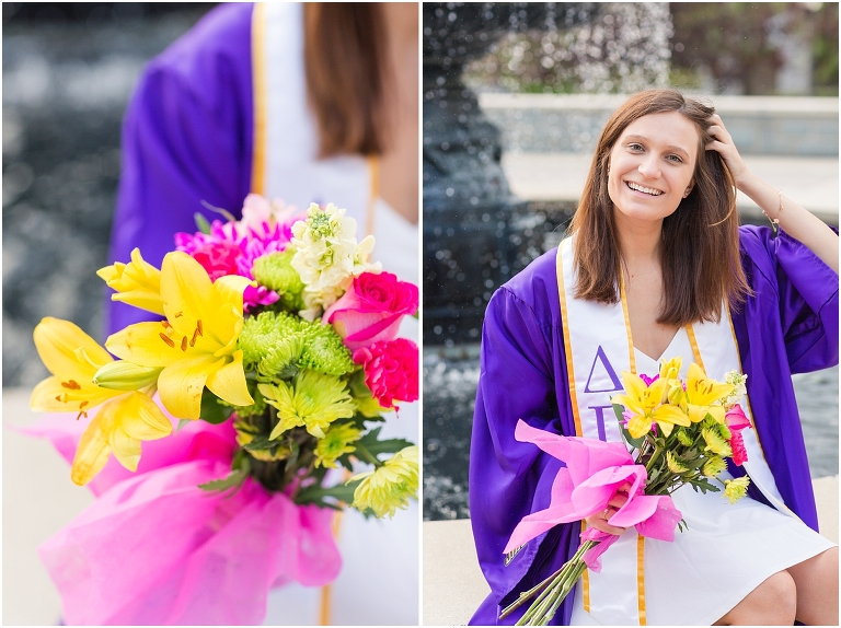 JMU senior holds a bouquet of flowers while sitting at a fountain.