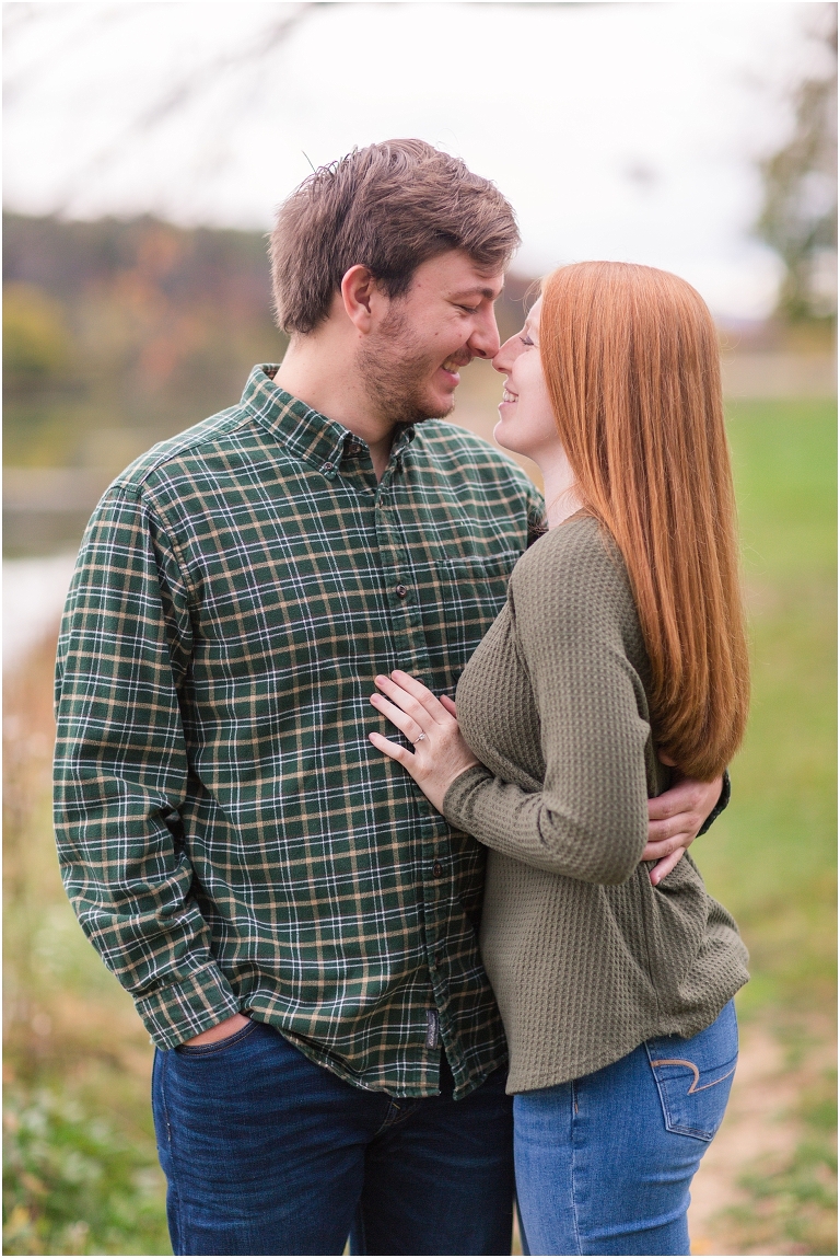 Autumn engagement session at Lake Shenandoah with fall colors with beautiful lake in background.