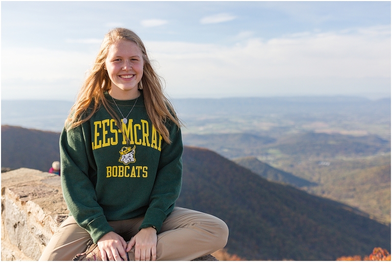 Sunset Hawksbill Summit Skyline Drive senior session with fall foliage and rolling clouds