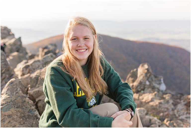 Sunset Hawksbill Summit Skyline Drive senior session with fall foliage and rolling clouds