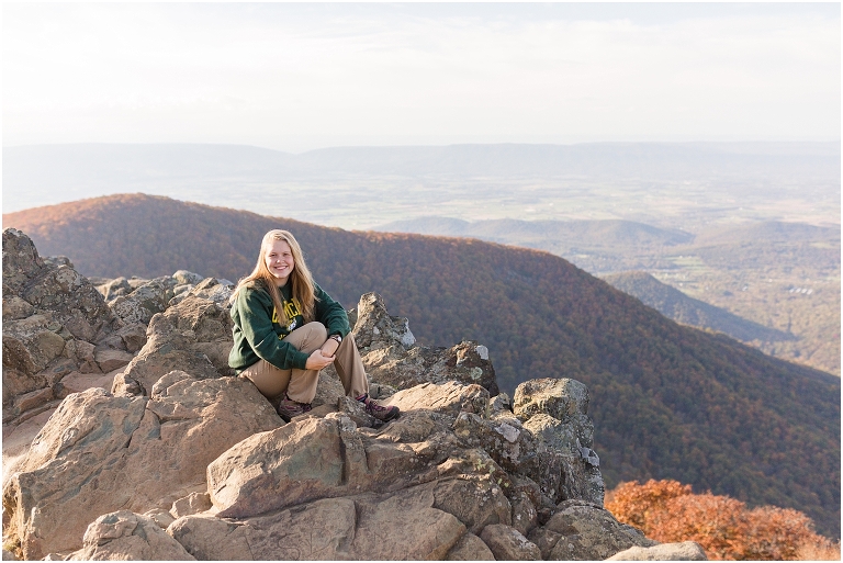 Sunset Hawksbill Summit Skyline Drive senior session with fall foliage and rolling clouds