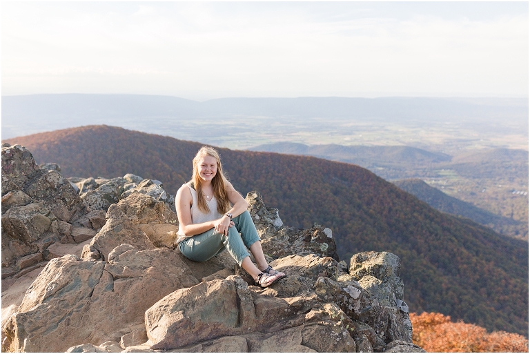 Sunset Hawksbill Summit Skyline Drive senior session with fall foliage and rolling clouds