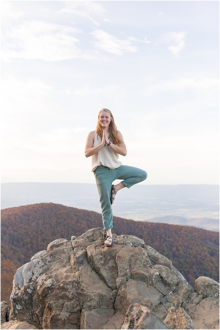 Sunset Hawksbill Summit Skyline Drive senior session with fall foliage and rolling clouds