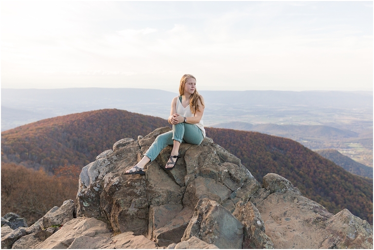 Sunset Hawksbill Summit Skyline Drive senior session with fall foliage and rolling clouds