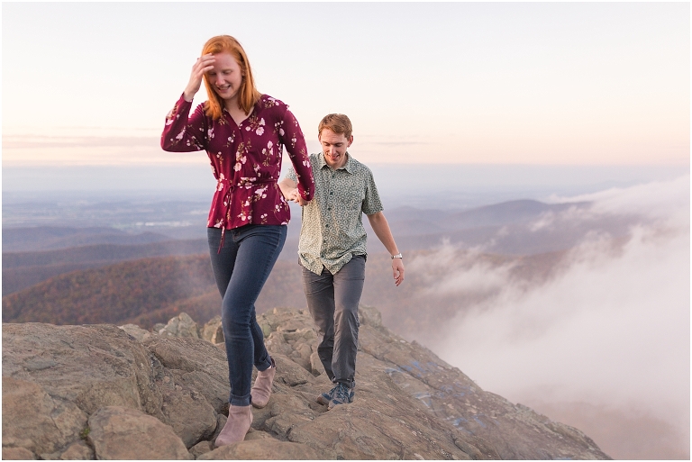 Engagement session at Humpback Rocks during sunset, surrounded by fall colors and blue sky.