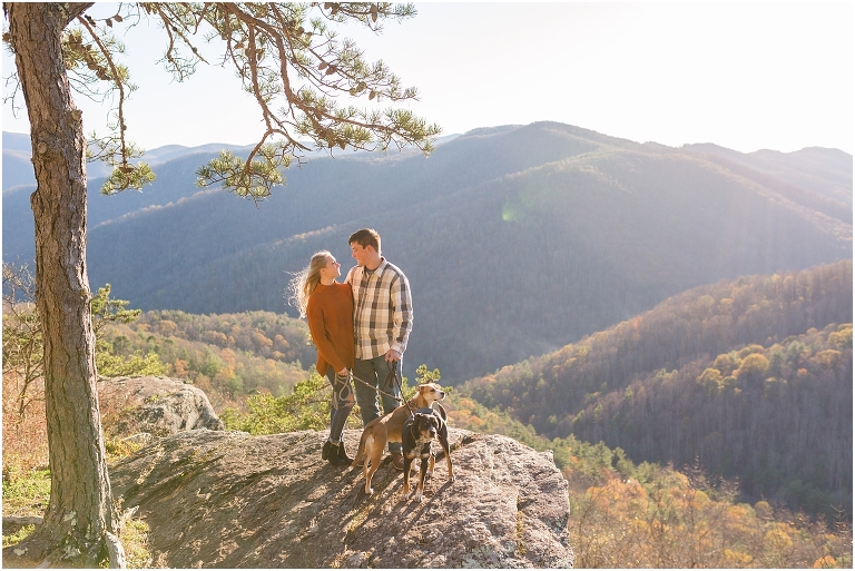 Blue Ridge engagement session with fall foliage and blue skies surrounding them.  Blue Ridge Parkway in Virginia. 