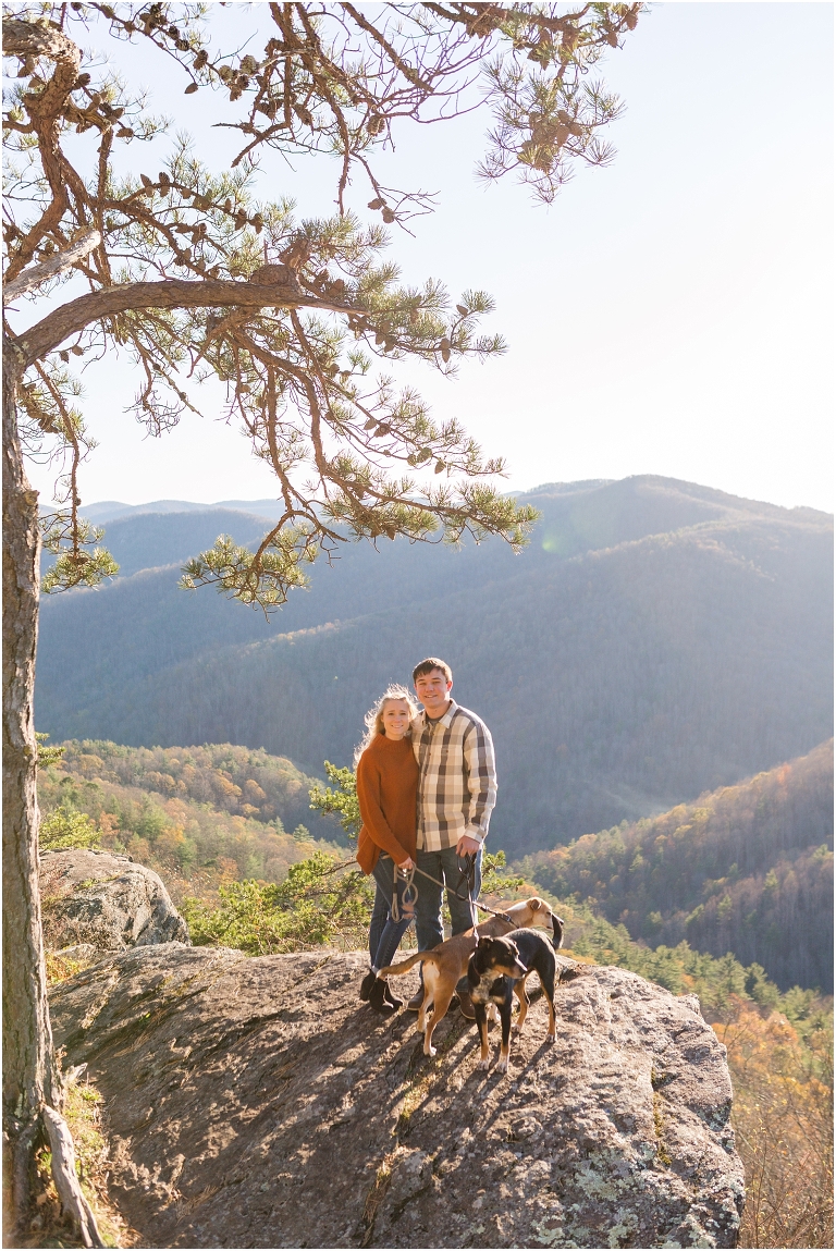 Blue Ridge engagement session with fall foliage and blue skies surrounding them.  Blue Ridge Parkway in Virginia. 