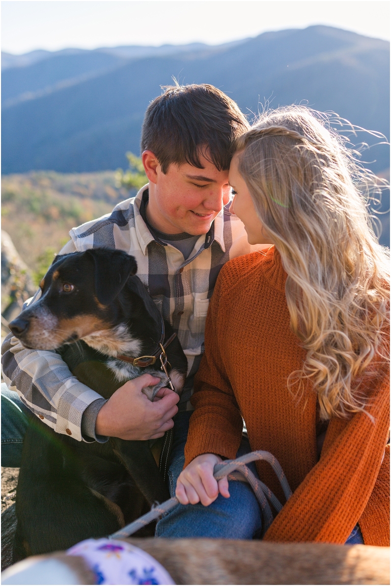 Blue Ridge engagement session with fall foliage and blue skies surrounding them.  Blue Ridge Parkway in Virginia. 
