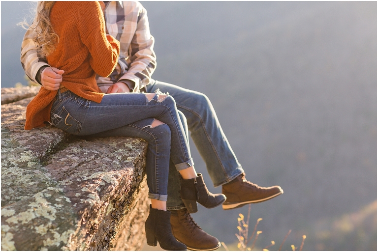 Blue Ridge engagement session with fall foliage and blue skies surrounding them.  Blue Ridge Parkway in Virginia. 