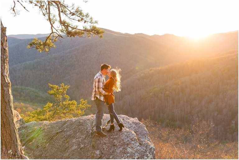 Blue Ridge engagement session with fall foliage and blue skies surrounding them.  Blue Ridge Parkway in Virginia. 