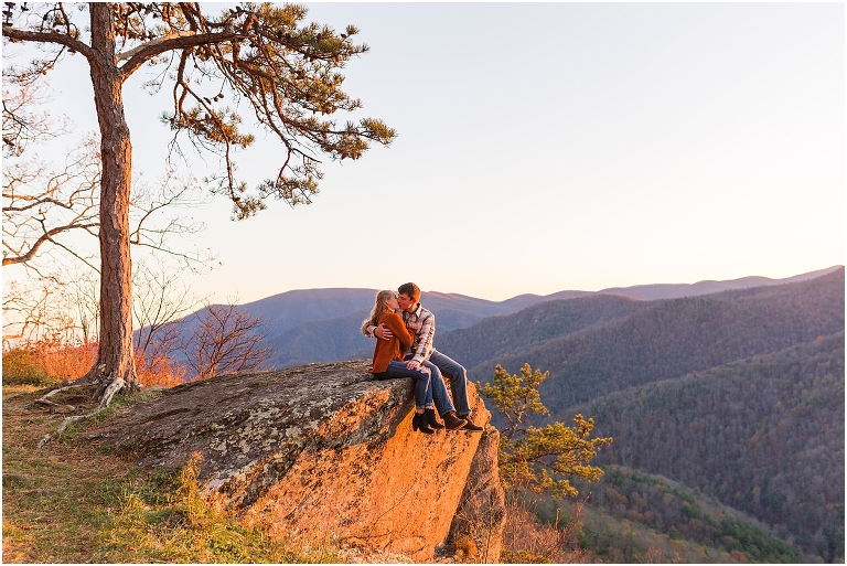 Blue Ridge engagement session with fall foliage and blue skies surrounding them.  Blue Ridge Parkway in Virginia. 