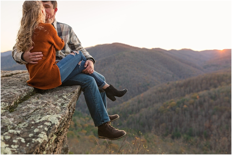 Blue Ridge engagement session with fall foliage and blue skies surrounding them.  Blue Ridge Parkway in Virginia. 