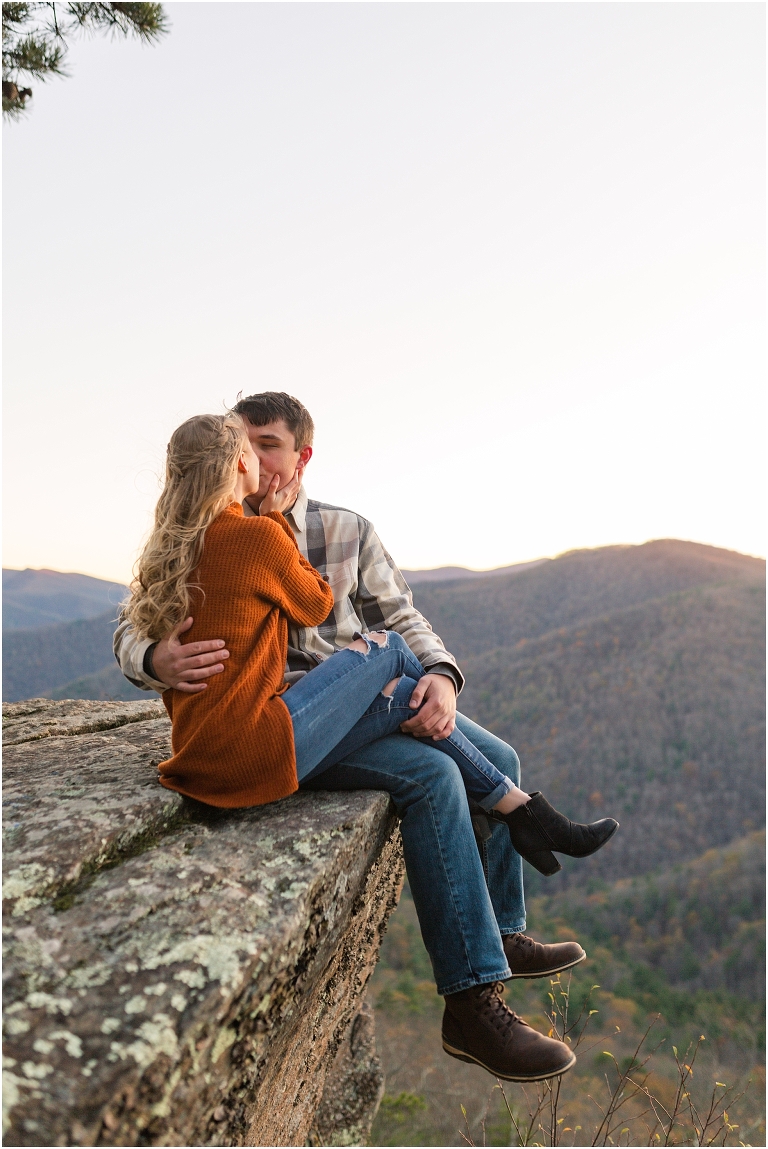 Blue Ridge engagement session with fall foliage and blue skies surrounding them.  Blue Ridge Parkway in Virginia. 