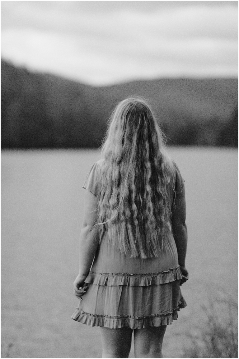 Sunset lakeside senior portraits in black and white