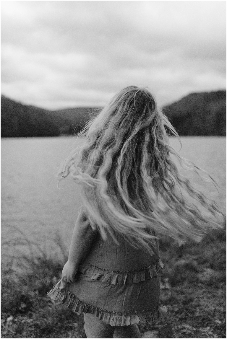 Sunset lakeside senior portraits in black and white