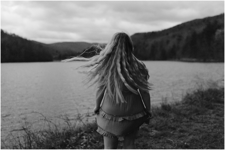 Sunset lakeside senior portraits in black and white