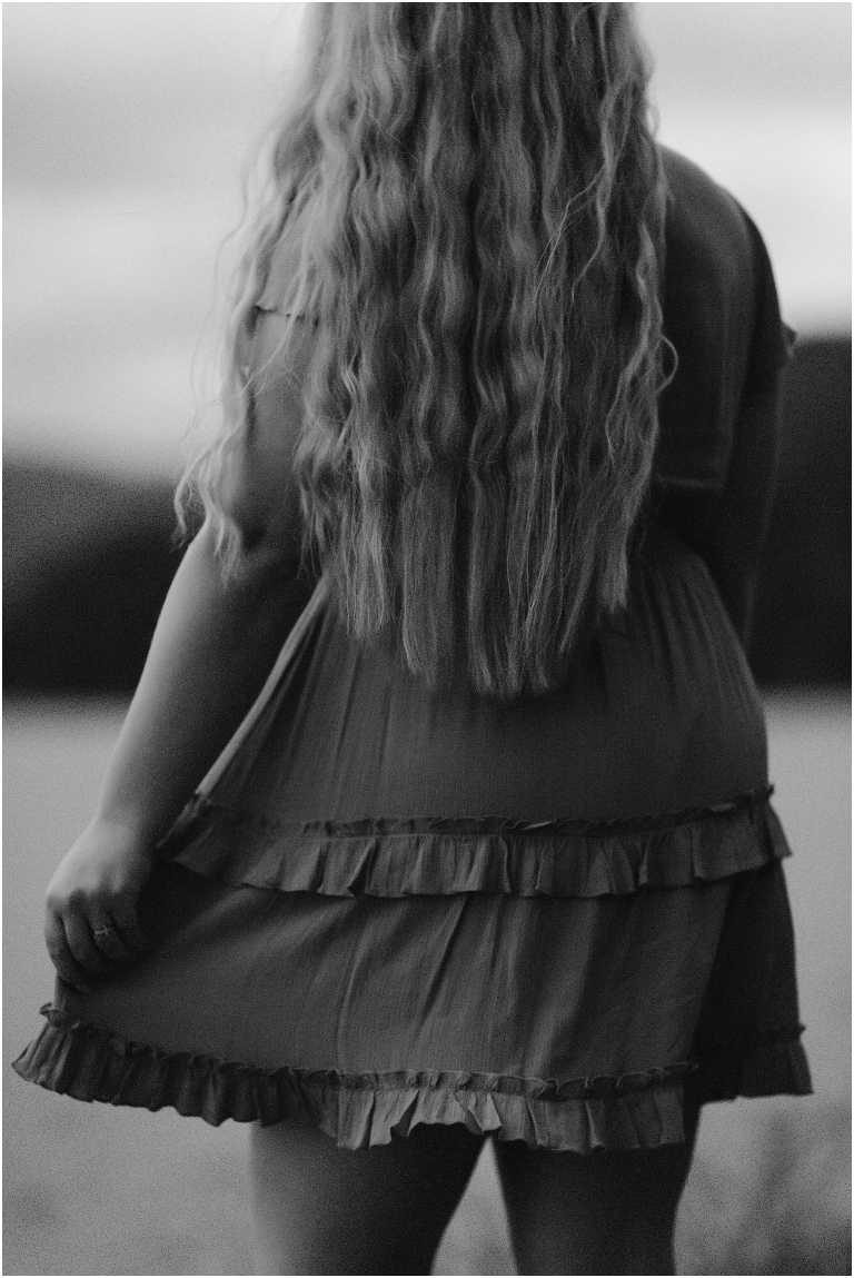 Sunset lakeside senior portraits in black and white