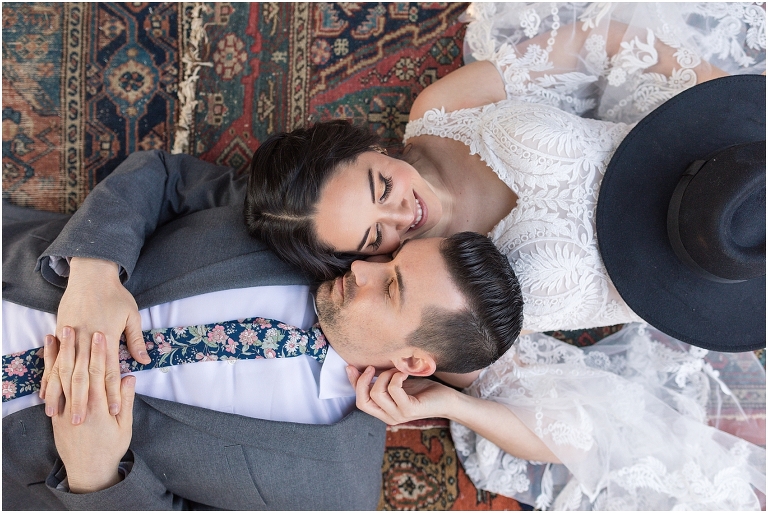 Boho intimate wedding elopement inspiration under the ivy at a reflecting pool in Virginia with macrame wedding arbor, pampas grass, and a boho wedding setup