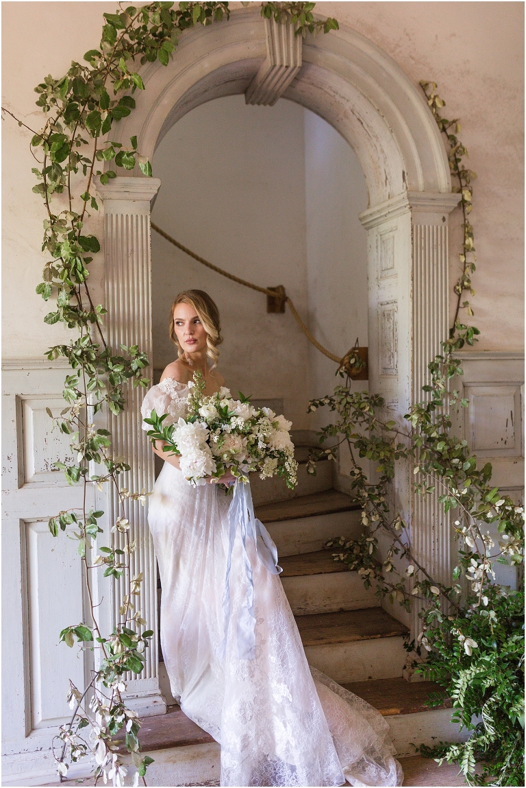 Romantic and classic garden manor wedding inspiration bridal portraits in a fairytale inspired ivy covered stairway