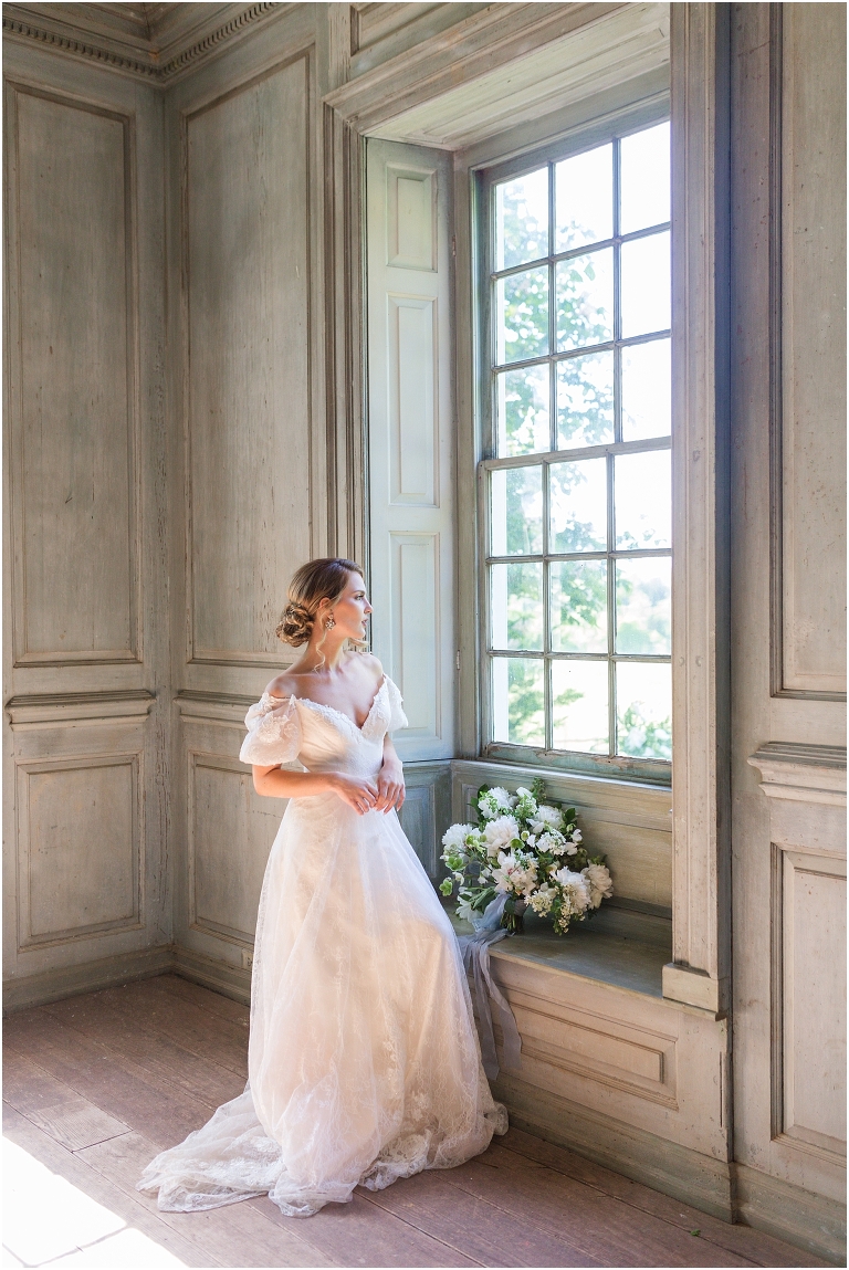 Romantic and classic garden manor wedding inspiration bridal portraits looking out the window light