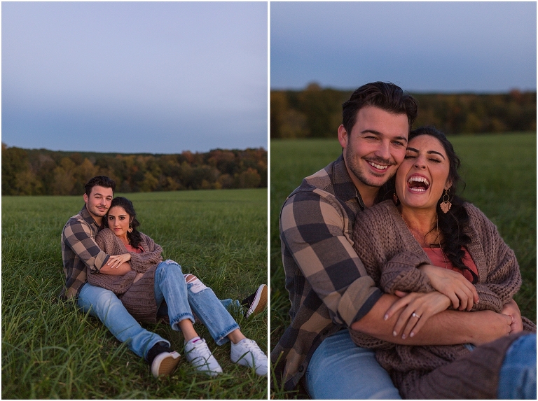 Autumn blue hour couples portraits sitting in the grass in an open field