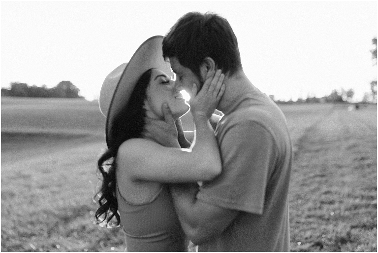 Country couples session in an open field during golden hour