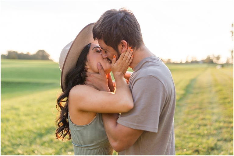 Country couples session in an open field during golden hour