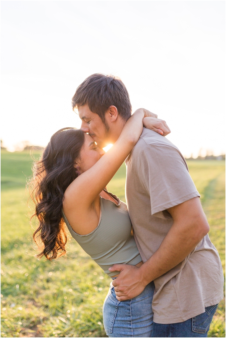 Country couples session in an open field during golden hour