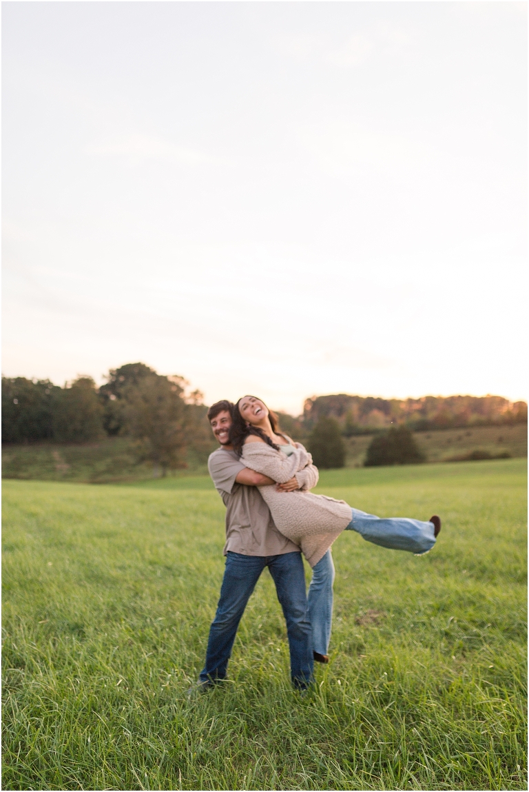 Country couples session in an open field during golden hour