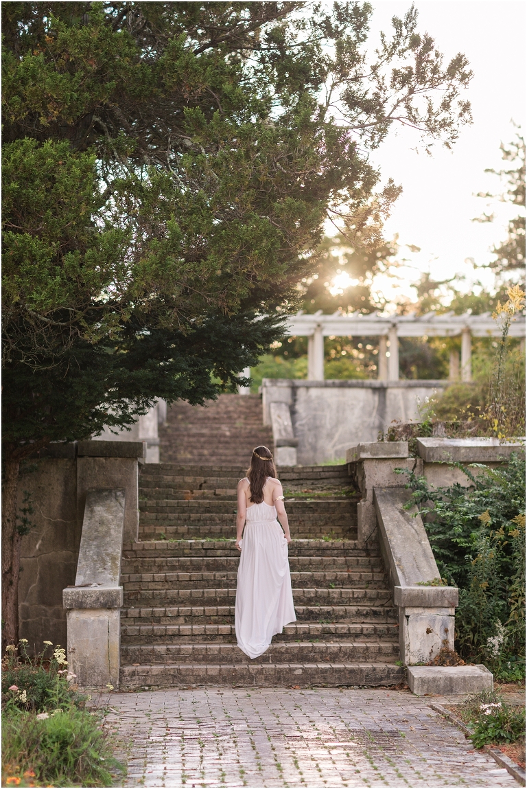 Aphrodite Greek Mythology goddess of beauty and love inspired portrait session white dress golden crown in an abandoned white castle Swannanoa