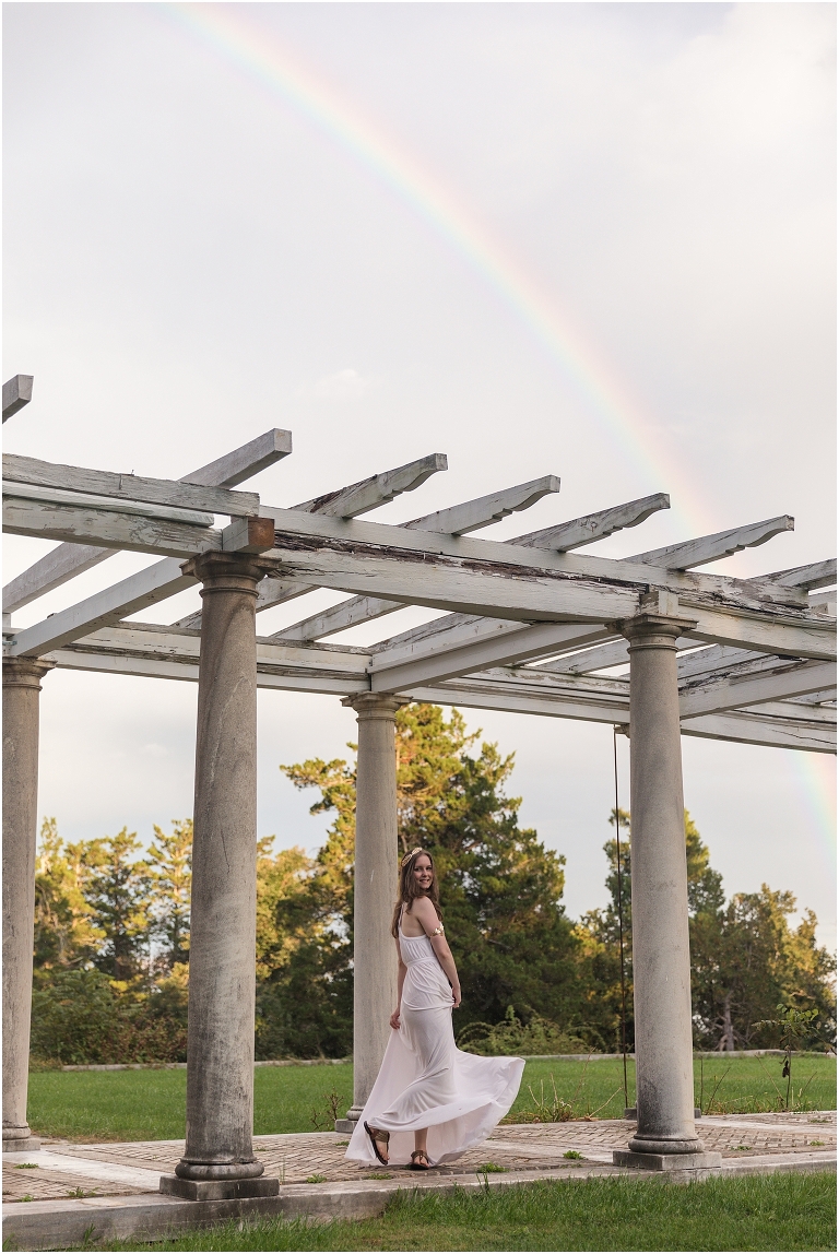 Aphrodite Greek Mythology goddess of beauty and love inspired portrait session white dress golden crown in an abandoned white castle Swannanoa with a rainbow