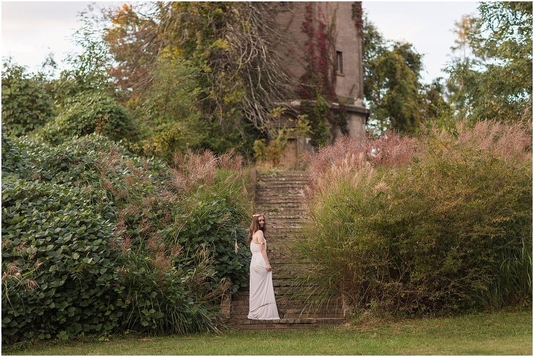 Aphrodite Greek Mythology goddess of beauty and love inspired portrait session white dress golden crown in an abandoned Rapunzel tower castle Swannanoa