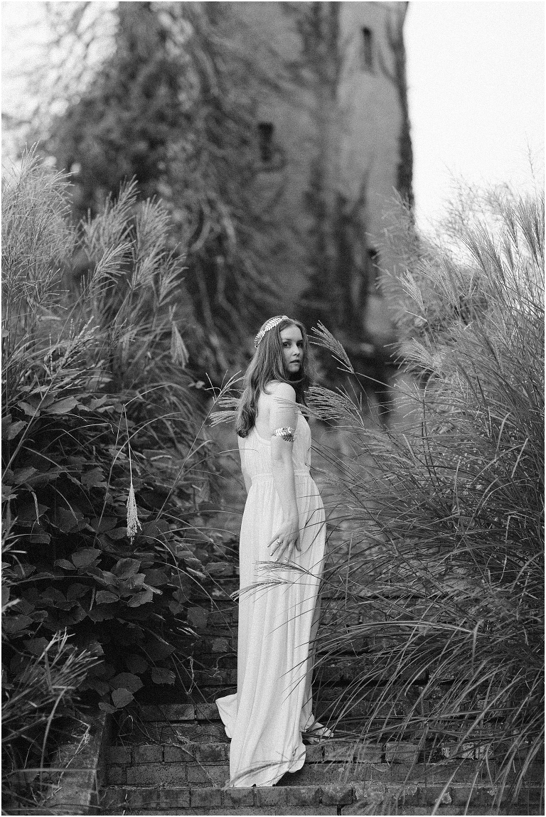 Aphrodite Greek Mythology goddess of beauty and love inspired portrait session white dress golden crown in an abandoned Rapunzel tower castle Swannanoa