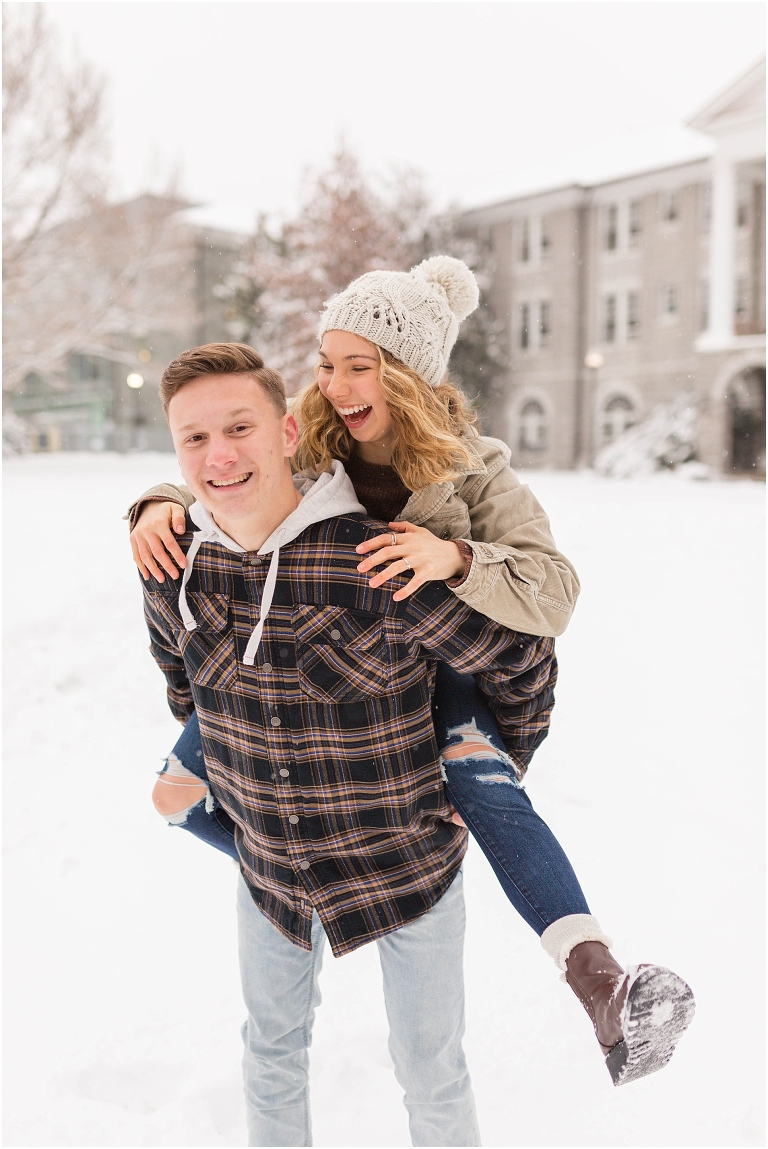 Harrisonburg fun snow couples portraits on the James Madison University Quad