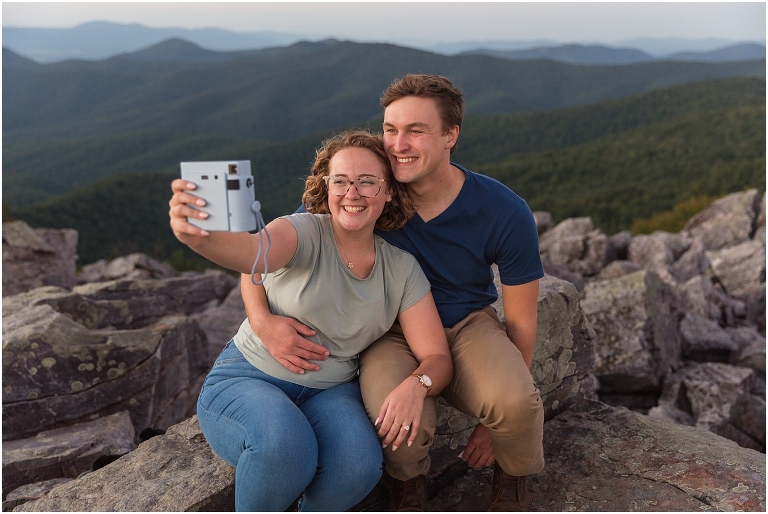 Blackrock Summit hike on Skyline Drive in Shenandoah National Park engagement session with the Corgi dog. Sunset mountain couples portrait session with polaroid camera