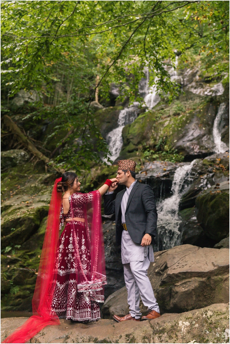 Waterfall wedding portraits Nepali Asian traditional clothing at Dark Hollow Falls hike on Skyline Drive in Shenandoah National Park
