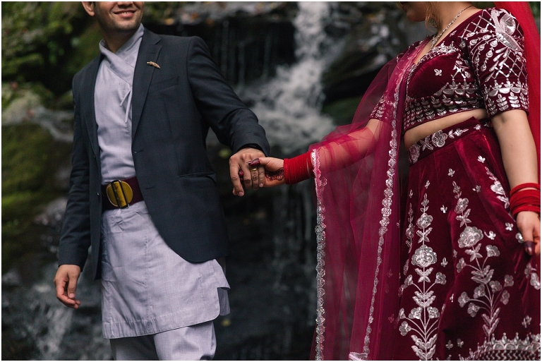 Waterfall wedding portraits Nepali Asian traditional clothing at Dark Hollow Falls hike on Skyline Drive in Shenandoah National Park