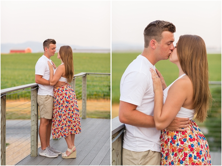 Summer couples portraits in an open field during golden hour with a mountain view