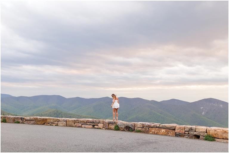 Abigail’s James Madison University Quad and Skyline Drive sunset mountain view overlook senior graduation portraits were some of my FAVORITE from the class of 2021, from her graduation outfit to popping champagne on top of the mountain in her cap and gown!