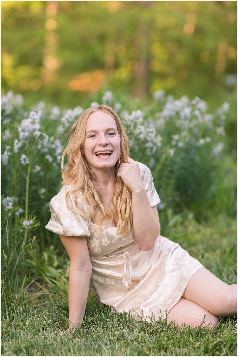 Spring arboretum senior portraits with a gold dress and purple flowers. Edith J Carrier Arboretum in Harrisonburg Virginia, senior graduation portrait photographer