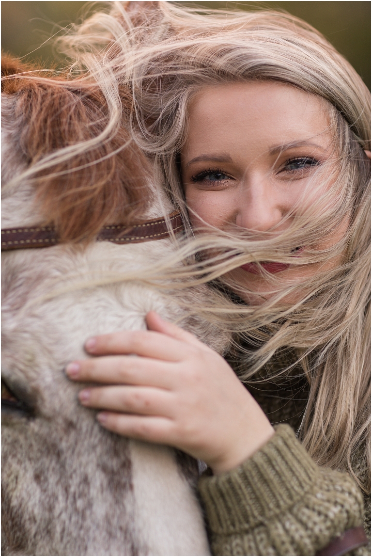 Autumn fall foliage senior horse portraits with a rust and white horse in an open field with a sunset mountain backdrop, Virginia senior graduation portrait photographer