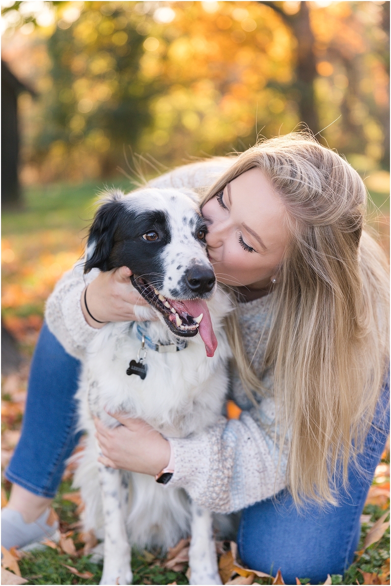 Autumn fall foliage senior with dog portraits in an open field with a sunset mountain backdrop, Virginia senior graduation portrait photographer