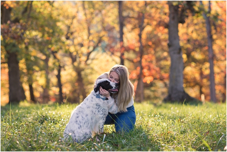 Autumn fall foliage senior with dog portraits in an open field with a sunset mountain backdrop, Virginia senior graduation portrait photographer
