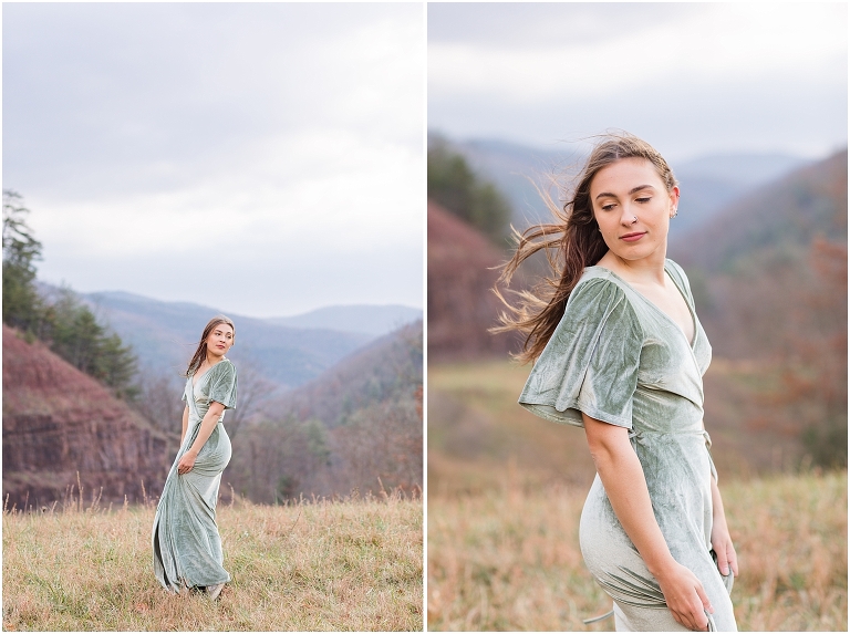 Windy senior portraits in a green velvet dress next to Switzer Lake with a mountain background at sunset, Virginia senior graduation portrait photographer