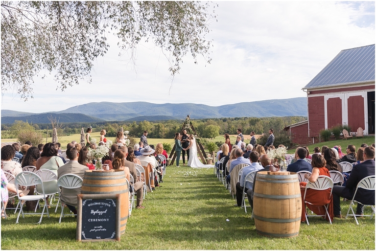 Victoria & Logan's mountain view farm wedding with the sweetest first touch and letter reading.