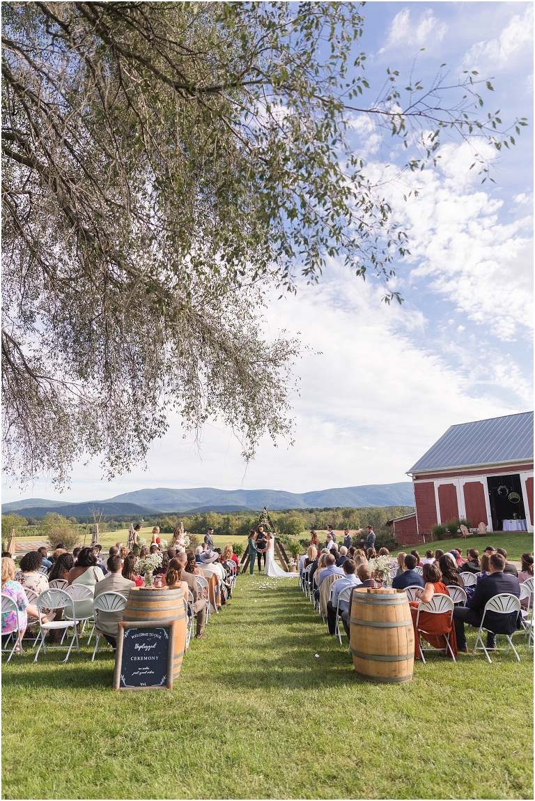 Victoria & Logan's mountain view farm wedding with the sweetest first touch and letter reading.