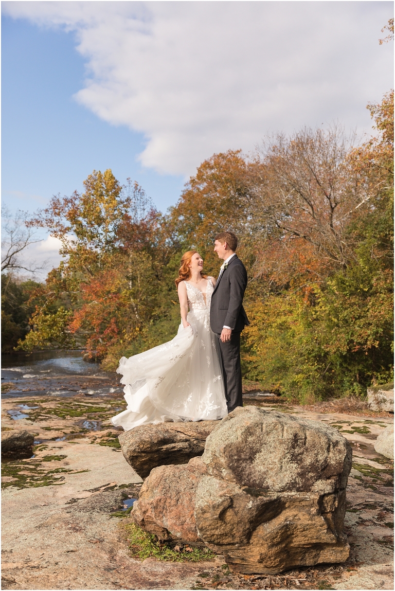 Emma & Dan's The Mill at Fine Creek Richmond autumn wedding with a riverside first look, ceremony in the garden surrounded by fall foliage, and portraits in the fairy light lit abandoned mill at dusk.