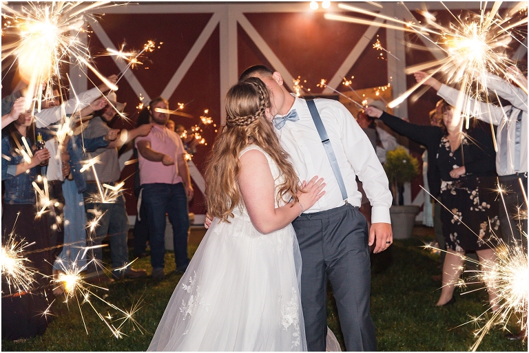 Abby & Travis's rainy wedding at Red August Farm in the Shenandoah Valley, Virginia with clear umbrella wedding portraits and a sparkler exit.